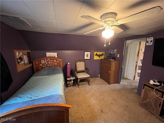 bedroom featuring ceiling fan and carpet