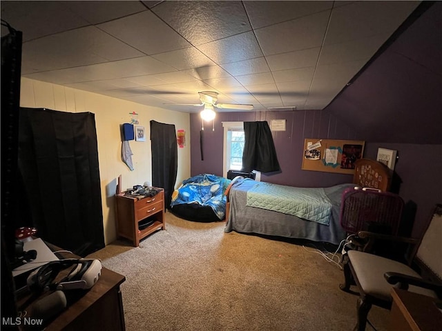 bedroom with ceiling fan, carpet flooring, and vaulted ceiling