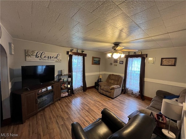 living room with hardwood / wood-style floors and ceiling fan