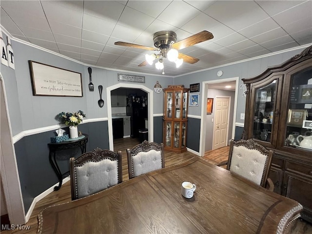 dining area featuring ornamental molding, hardwood / wood-style floors, and ceiling fan