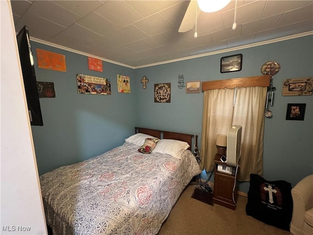 bedroom with crown molding and carpet flooring