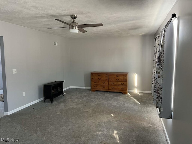 unfurnished bedroom featuring a textured ceiling and ceiling fan