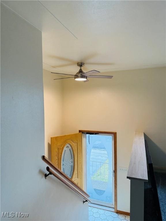 room details featuring ceiling fan and baseboards