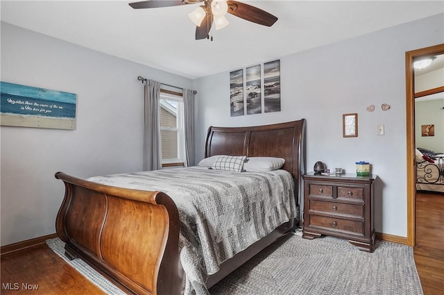 bedroom featuring hardwood / wood-style flooring and ceiling fan