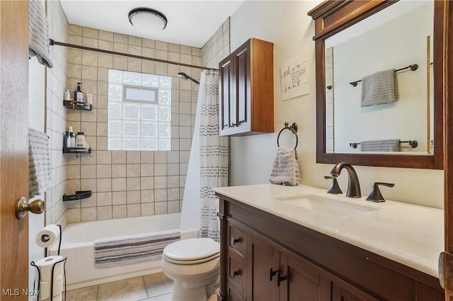 full bathroom featuring vanity, tile patterned floors, shower / bath combination with curtain, and toilet