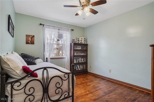 bedroom with ceiling fan and hardwood / wood-style floors