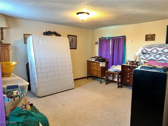 carpeted bedroom with a textured ceiling