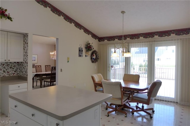 dining space with a notable chandelier