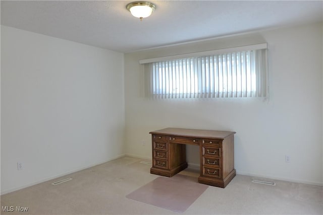 interior space featuring light colored carpet