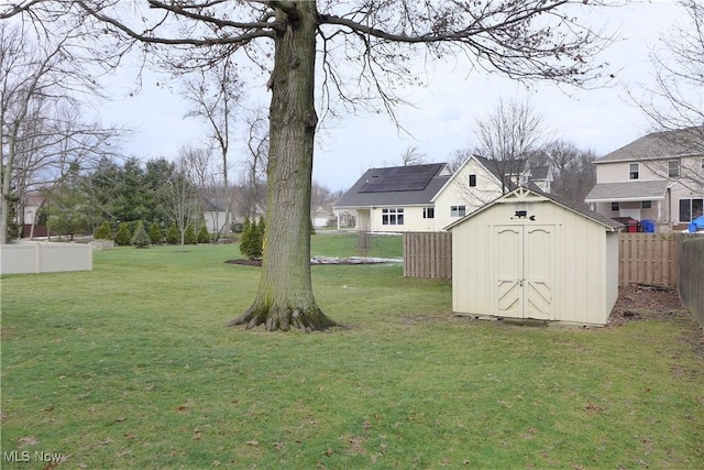 view of yard featuring a storage unit