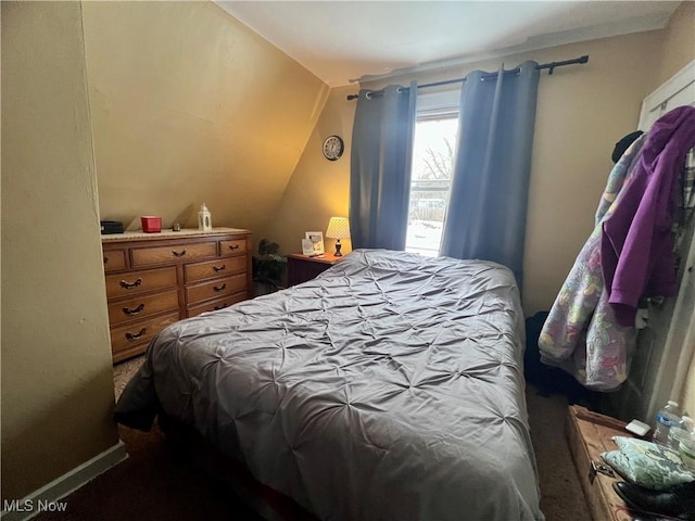 bedroom featuring vaulted ceiling