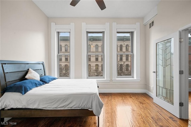 bedroom featuring hardwood / wood-style floors and ceiling fan