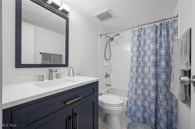 full bathroom with visible vents, toilet, shower / bath combo, a textured ceiling, and vanity