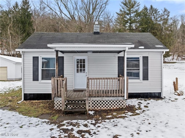 view of snow covered house