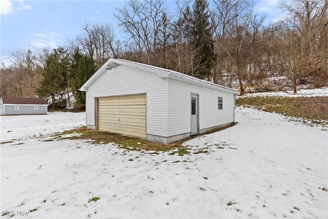 view of snow covered garage