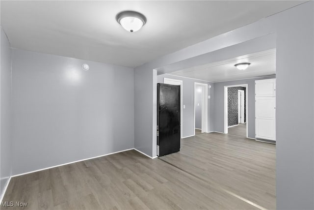 unfurnished room featuring light wood-type flooring