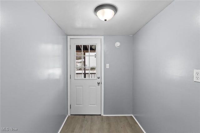 doorway to outside with light hardwood / wood-style floors