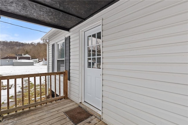 view of snow covered deck