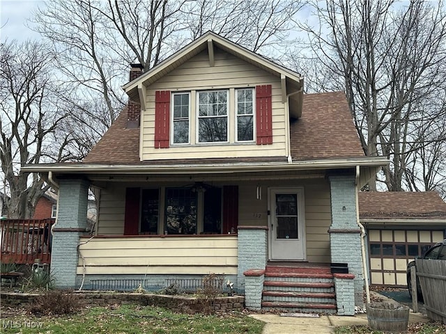 view of front of home with a porch and a garage