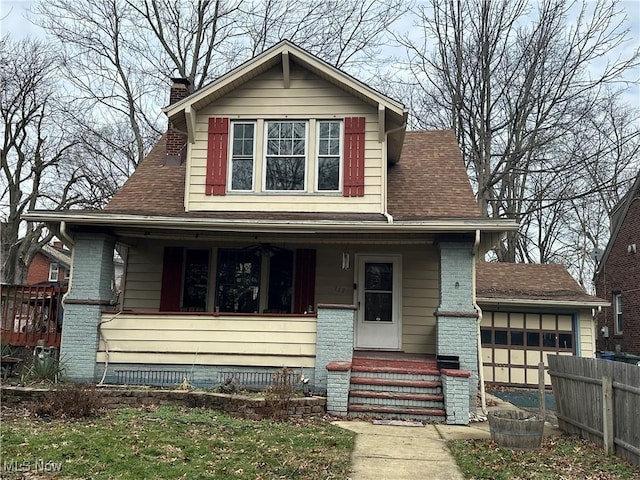 view of front of property with a garage and covered porch