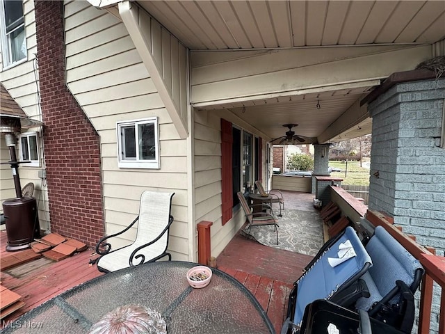 view of patio / terrace with ceiling fan, a porch, and a deck