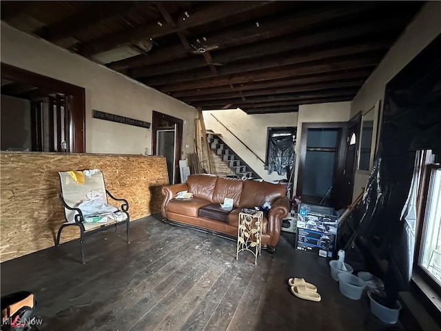 interior space featuring beam ceiling and hardwood / wood-style floors