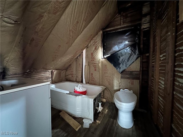 unfinished attic with washer / dryer