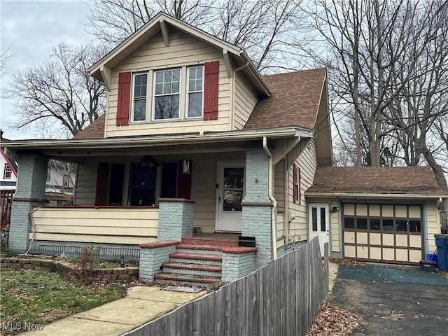 view of front of property featuring a garage and covered porch