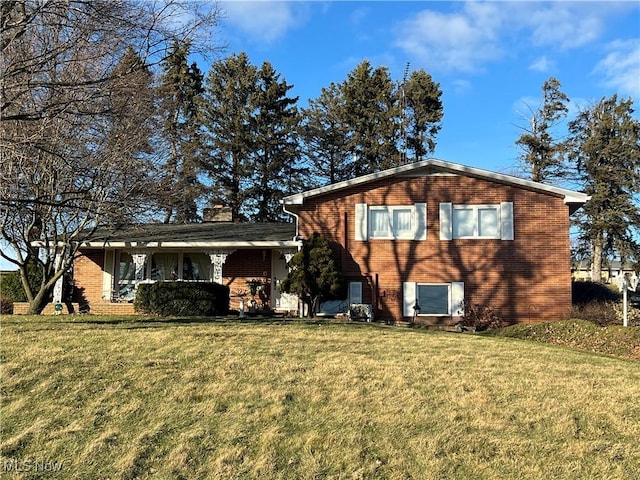 back of house featuring a yard