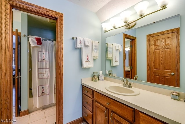 bathroom with vanity and tile patterned floors