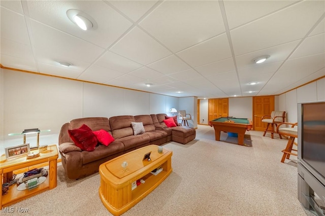 interior space with a drop ceiling, pool table, and light colored carpet