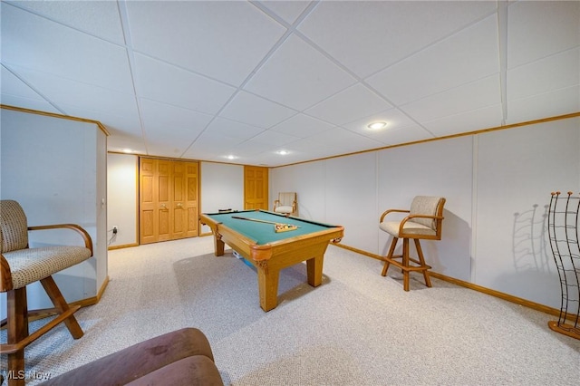 game room with billiards, a paneled ceiling, and light colored carpet