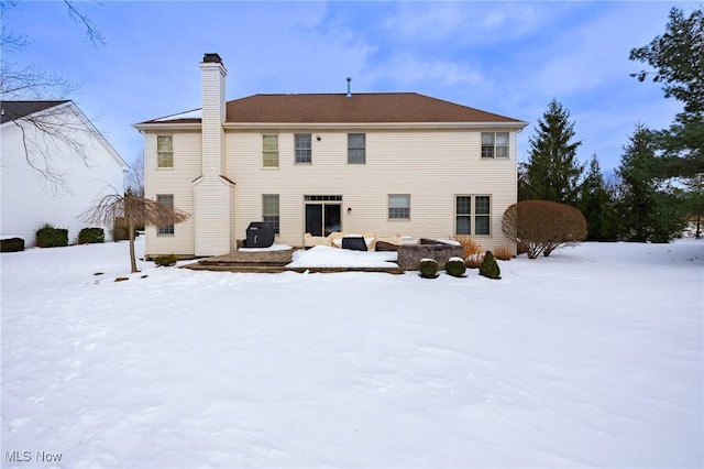 view of snow covered property