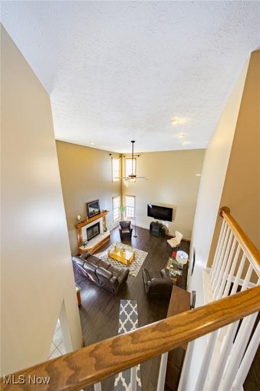 living room with hardwood / wood-style flooring and a textured ceiling