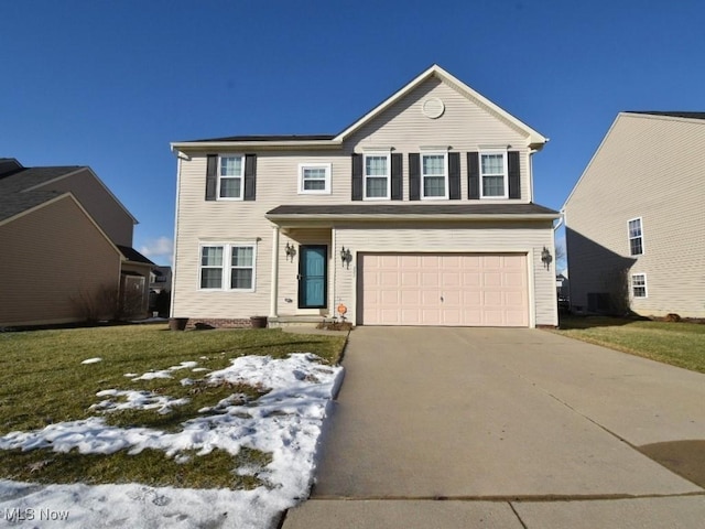 view of front of property with a garage, central AC, and a front yard