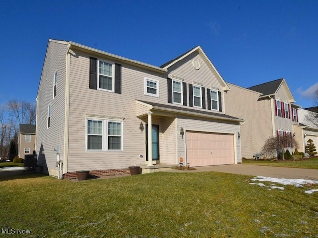 view of front of property with a garage and a front lawn