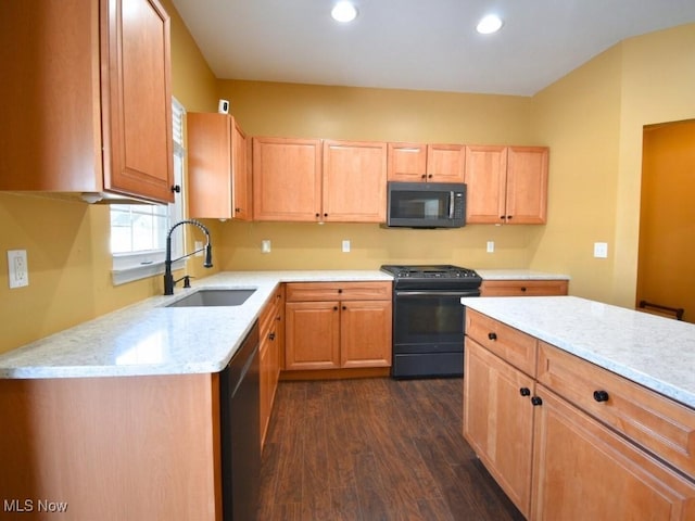 kitchen with sink, light stone countertops, gas stove, dark hardwood / wood-style flooring, and stainless steel dishwasher