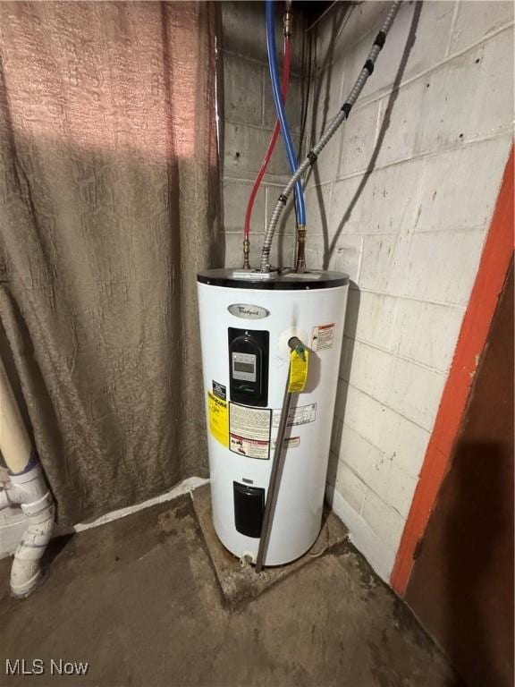 utility room with electric water heater