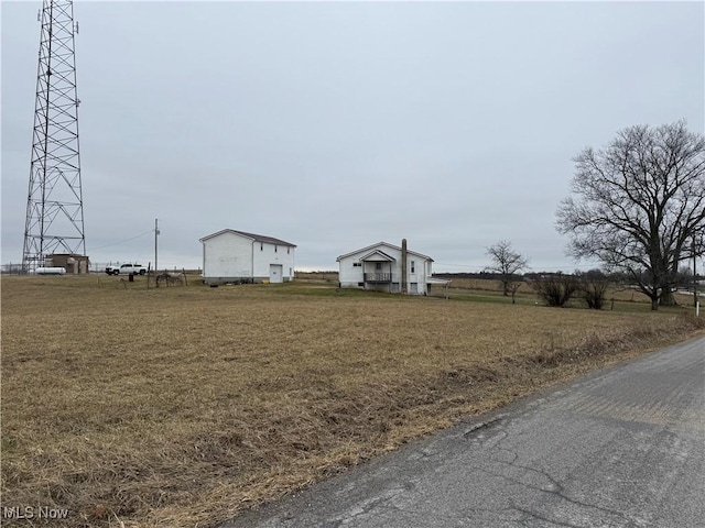 view of yard with a rural view