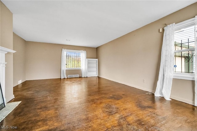 unfurnished living room featuring dark hardwood / wood-style flooring