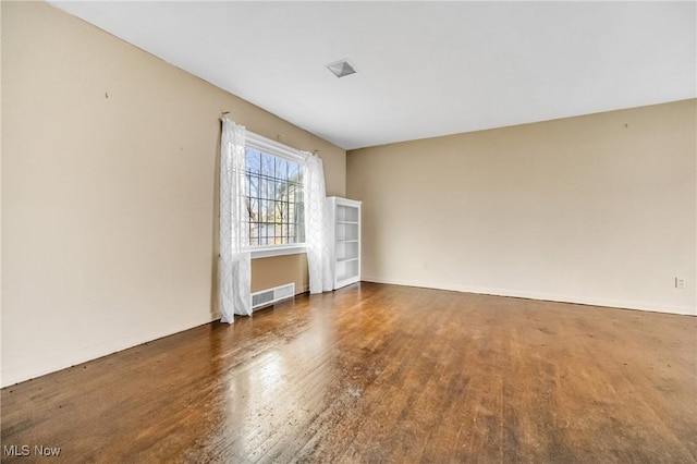 empty room featuring dark hardwood / wood-style floors