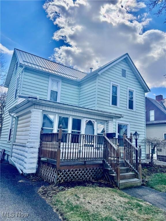124 W Slingluff Ave, Dover, OH 44622 - view of front of home with metal roof, a standing seam roof, and a deck