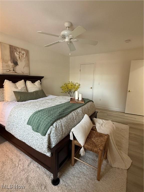 bedroom featuring hardwood / wood-style flooring and ceiling fan