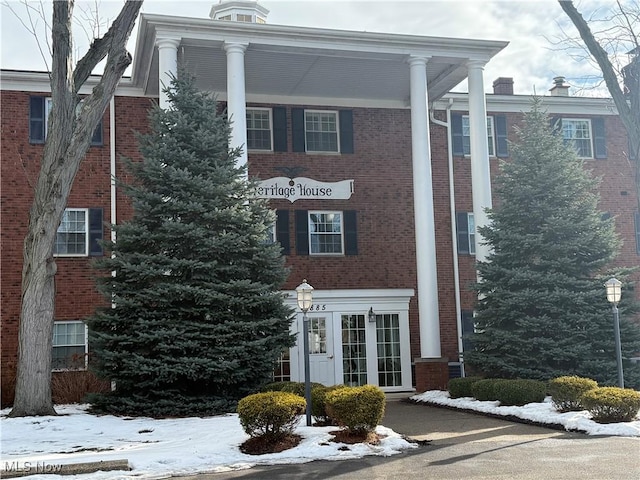 view of snow covered property