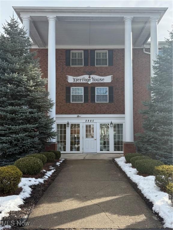 view of snow covered property entrance