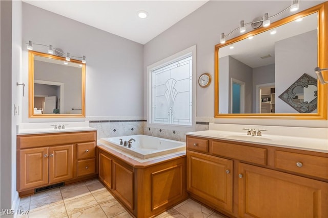 bathroom featuring vanity and a bathing tub