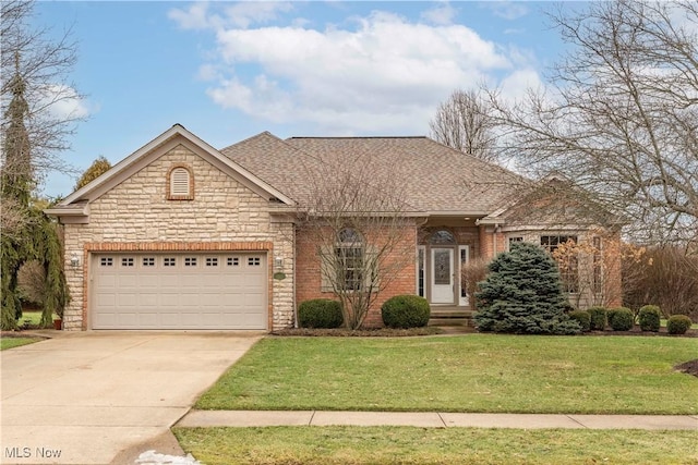 view of front facade featuring a garage and a front lawn