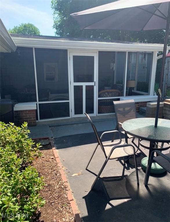 exterior space featuring a sunroom