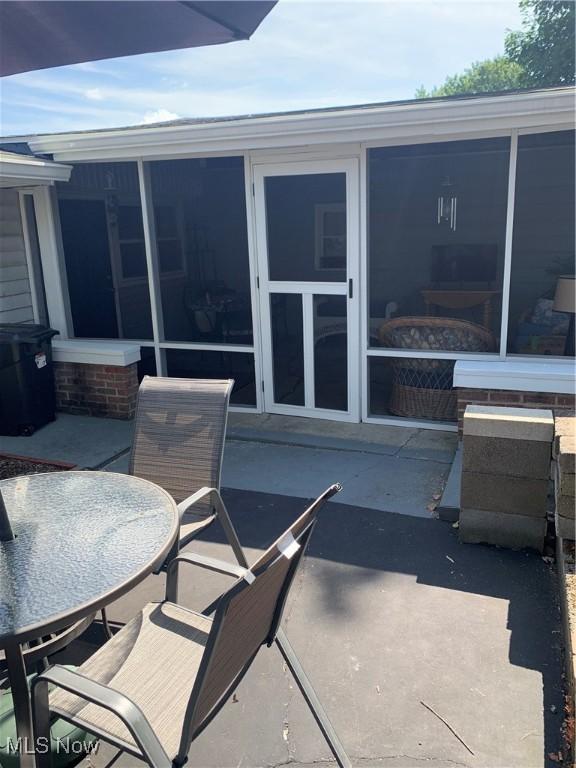 view of patio / terrace with a sunroom