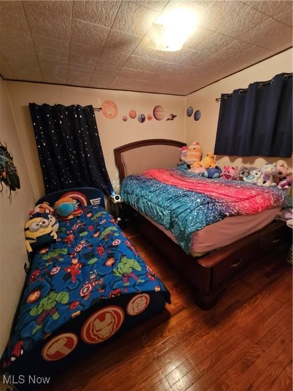 bedroom featuring wood-type flooring